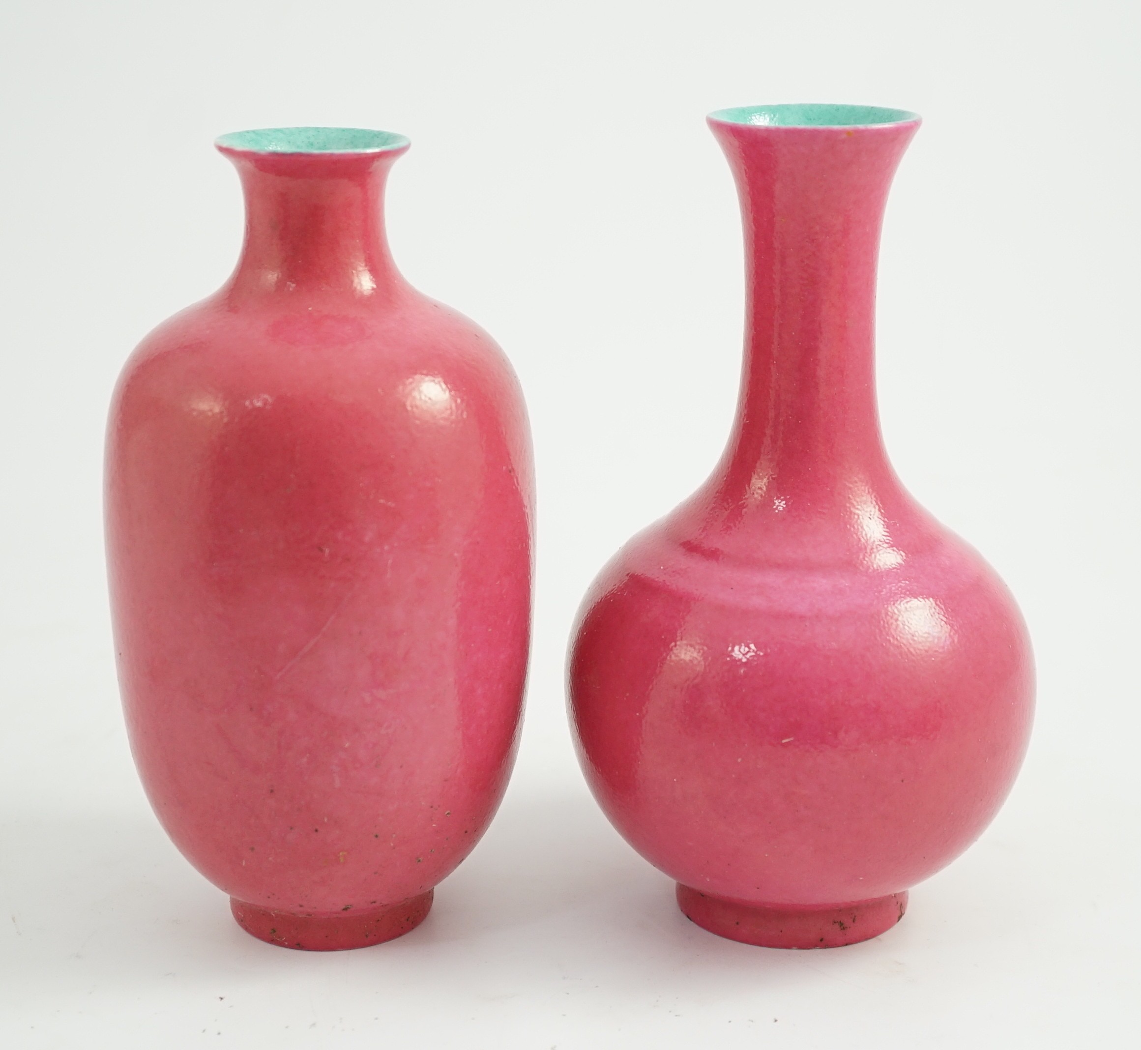 Two Chinese ruby ground vases, possibly Republic period, each with a printed four character Qianlong mark, 18.5 and 19.4cm high